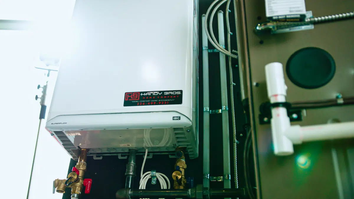 A compact and energy-efficient tankless water heater mounted on a wall, providing on-demand hot water for a home or business.