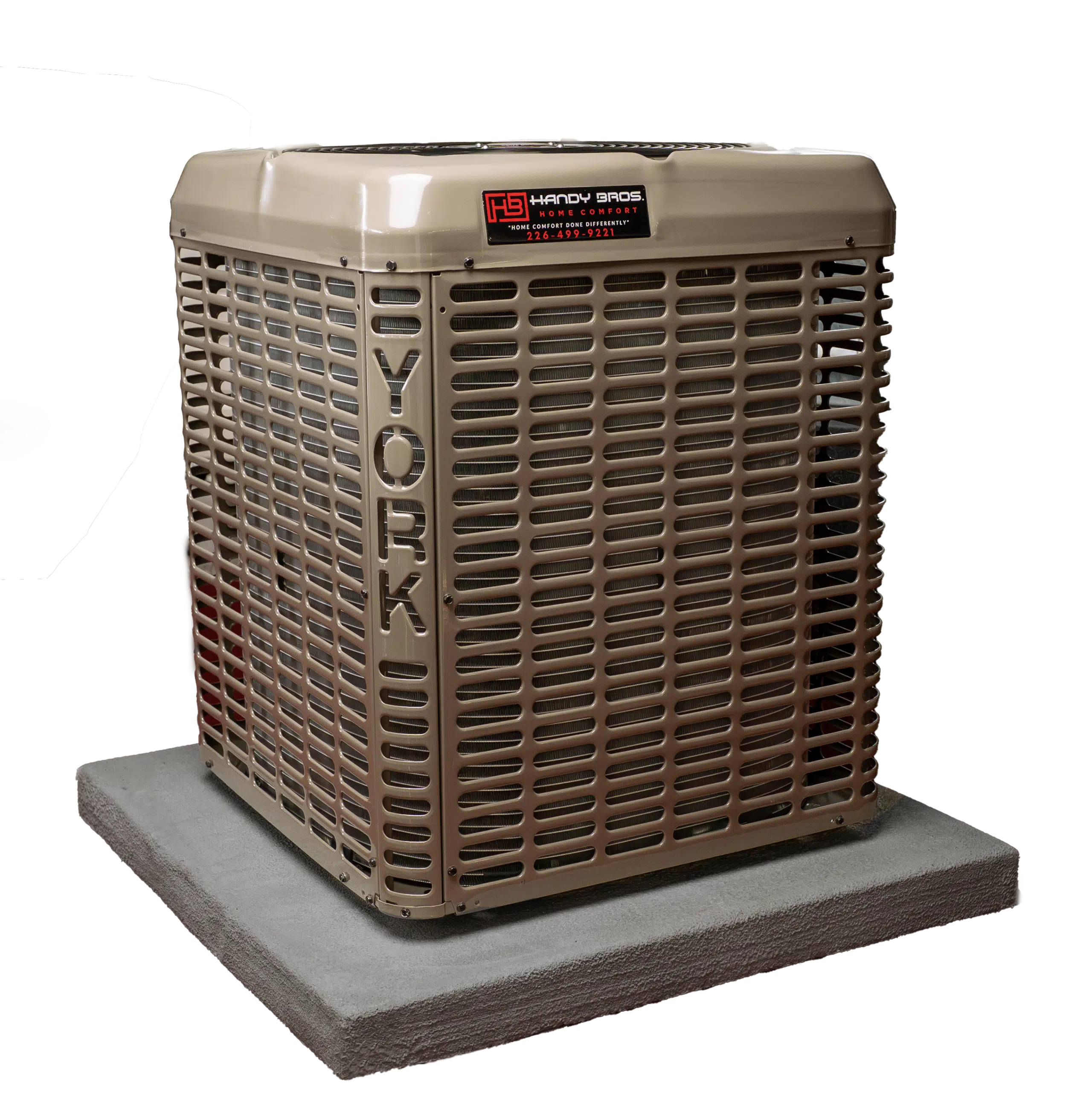 A York air conditioning unit with Hardy Bros branding sits on a concrete slab, ready to deliver powerful cooling against a plain white background.
