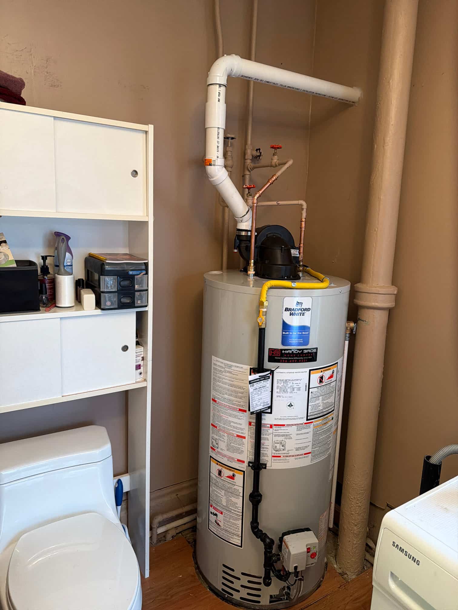 power vent draft water heater in basement of a home