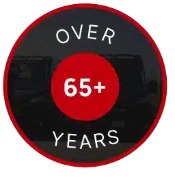 A circular badge with OVER 65+ YEARS written in white text on a black and red background.